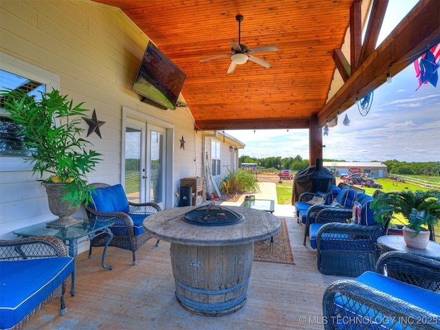 830294 S 3530, Stroud, OK 74079 - view of patio featuring french doors, an outdoor living space with a fire pit, ceiling fan, and a wooden deck