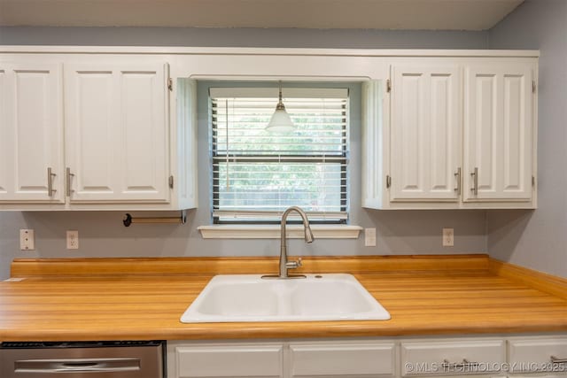 1605 W Montgomery St, Broken Arrow, OK 74012 - kitchen featuring a sink, white cabinets, stainless steel dishwasher, and light countertops