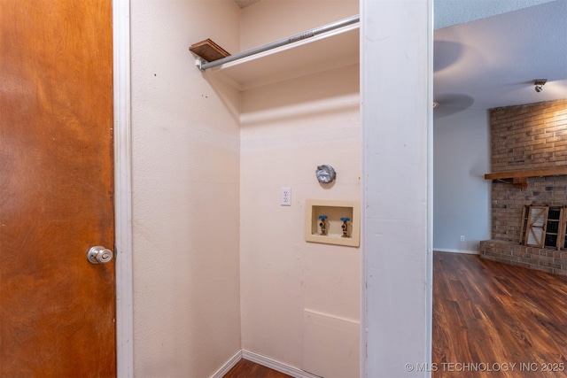 1605 W Montgomery St, Broken Arrow, OK 74012 - washroom with hookup for a washing machine, wood finished floors, a brick fireplace, and baseboards