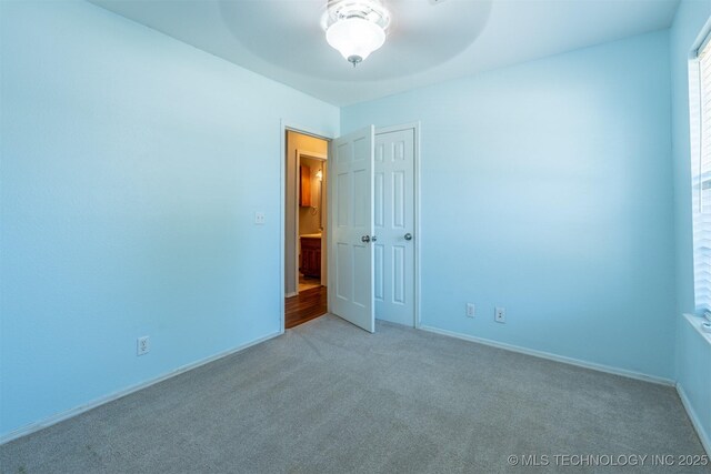 1605 W Montgomery St, Broken Arrow, OK 74012 - carpeted empty room featuring ceiling fan and baseboards