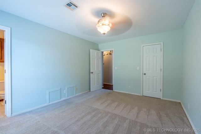 1605 W Montgomery St, Broken Arrow, OK 74012 - unfurnished bedroom featuring carpet floors, baseboards, and ensuite bathroom