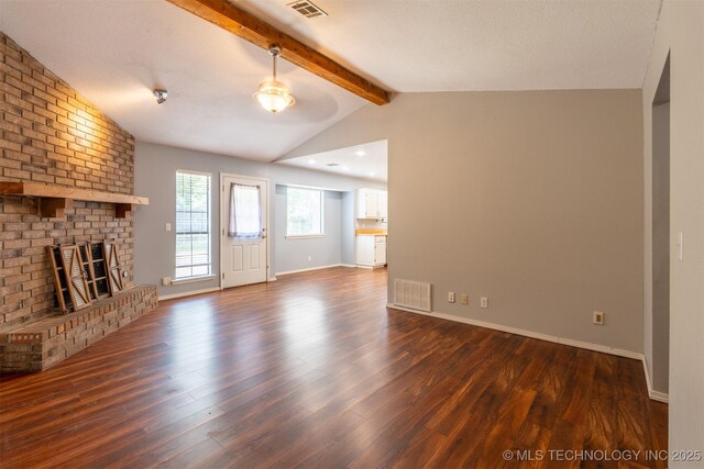 1605 W Montgomery St, Broken Arrow, OK 74012 - unfurnished living room with dark wood-style flooring, a brick fireplace, and baseboards