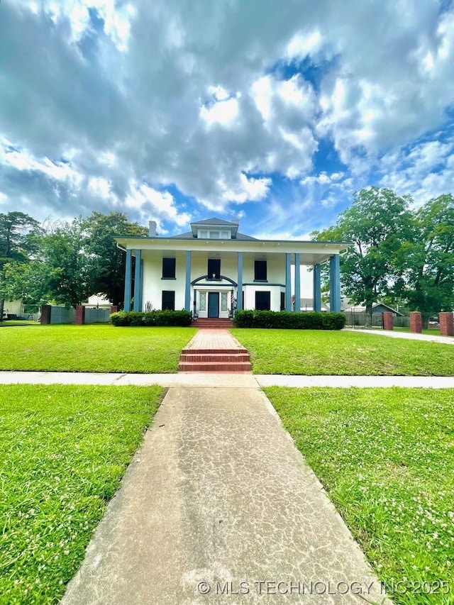 211 F SW, Ardmore, OK 73401 - neoclassical / greek revival house featuring a front lawn and stucco siding