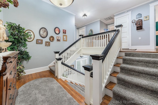 211 F SW, Ardmore, OK 73401 - stairway with wood finished floors, ornamental molding, and baseboards