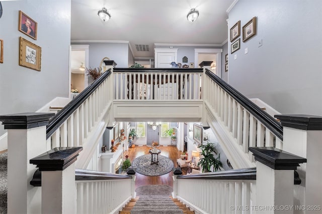 211 F SW, Ardmore, OK 73401 - staircase featuring crown molding and wood finished floors