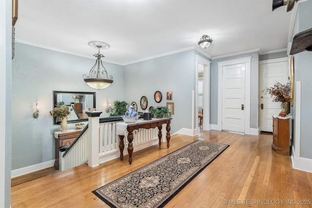 211 F SW, Ardmore, OK 73401 - entrance foyer featuring hardwood / wood-style flooring, crown molding, and baseboards
