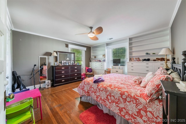 211 F SW, Ardmore, OK 73401 - bedroom with crown molding, wood finished floors, and a ceiling fan