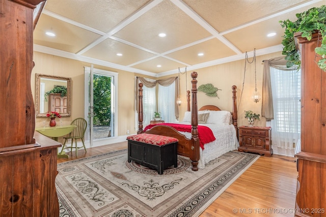 211 F SW, Ardmore, OK 73401 - bedroom featuring coffered ceiling, light wood finished floors, access to outside, ornamental molding, and beamed ceiling