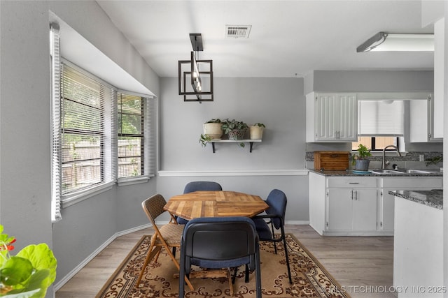 401 W Birmingham St, Broken Arrow, OK 74011 - dining room featuring light wood-style floors and baseboards