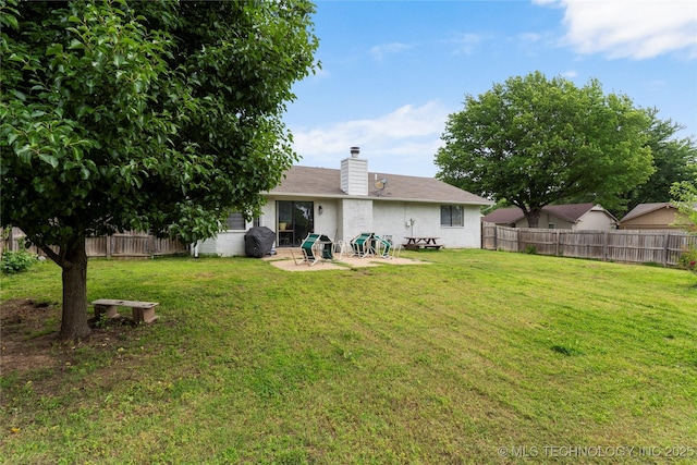 401 W Birmingham St, Broken Arrow, OK 74011 - back of house featuring a chimney and a patio area