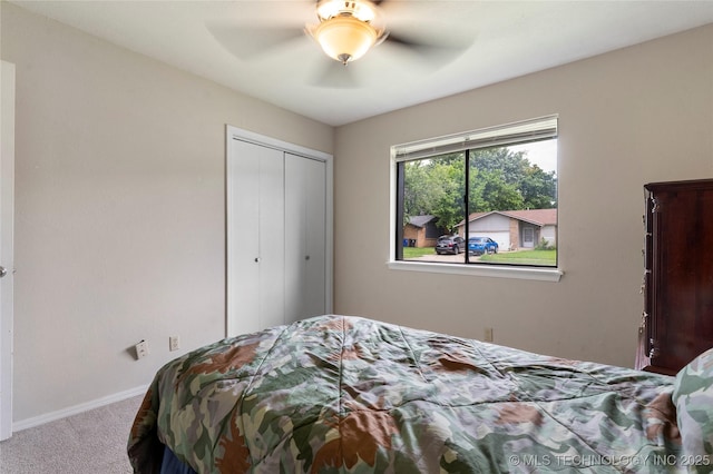 401 W Birmingham St, Broken Arrow, OK 74011 - bedroom with carpet flooring, a closet, baseboards, and a ceiling fan