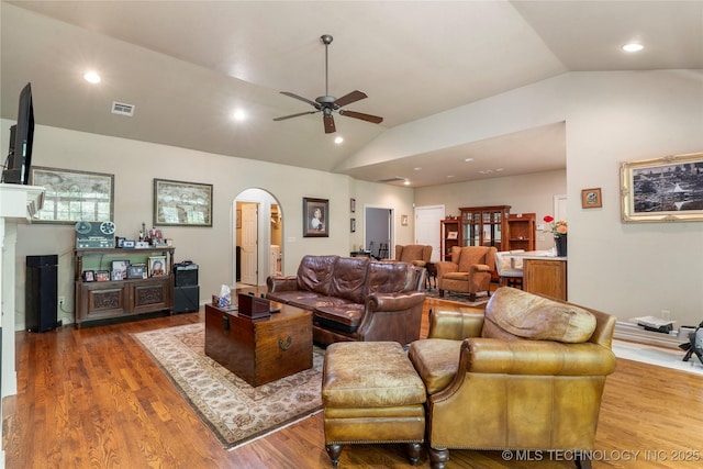 420 Fox Wood Dr, Sapulpa, OK 74066 - living area with lofted ceiling, arched walkways, ceiling fan, wood finished floors, and recessed lighting
