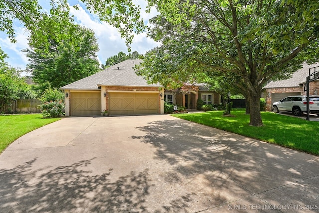11586 S 66th E Ave, Bixby, OK 74008 - view of front of home featuring an attached garage, concrete driveway, and roof with shingles