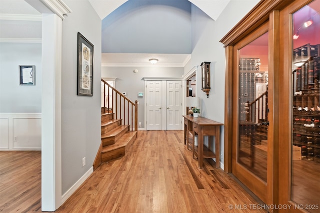11586 S 66th E Ave, Bixby, OK 74008 - entryway with stairs, light wood-type flooring, crown molding, vaulted ceiling, and baseboards
