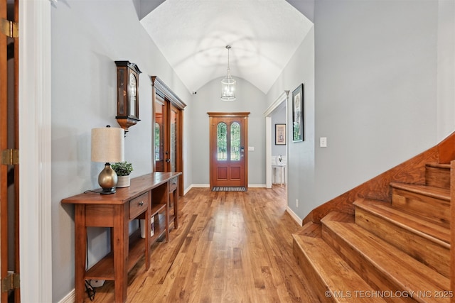 11586 S 66th E Ave, Bixby, OK 74008 - entryway featuring vaulted ceiling, light wood-type flooring, baseboards, and stairs