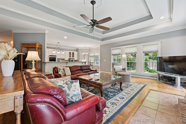 11586 S 66th E Ave, Bixby, OK 74008 - living room featuring ornamental molding, a ceiling fan, a raised ceiling, and recessed lighting