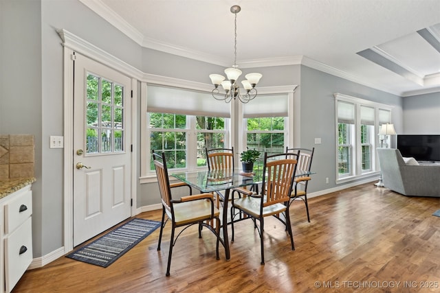 11586 S 66th E Ave, Bixby, OK 74008 - dining room featuring plenty of natural light, a chandelier, crown molding, and wood finished floors