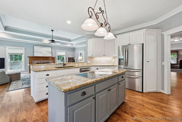 11586 S 66th E Ave, Bixby, OK 74008 - kitchen featuring appliances with stainless steel finishes, a sink, gray cabinetry, white cabinets, and healthy amount of natural light
