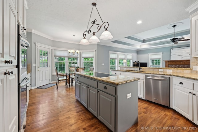 11586 S 66th E Ave, Bixby, OK 74008 - kitchen featuring appliances with stainless steel finishes, gray cabinetry, ornamental molding, a sink, and white cabinetry