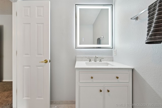11586 S 66th E Ave, Bixby, OK 74008 - bathroom featuring vanity, a textured wall, and baseboards