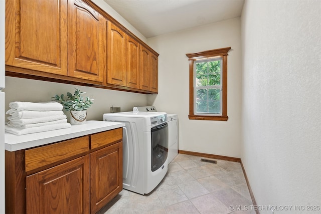 11586 S 66th E Ave, Bixby, OK 74008 - laundry room with cabinet space, baseboards, and washing machine and dryer
