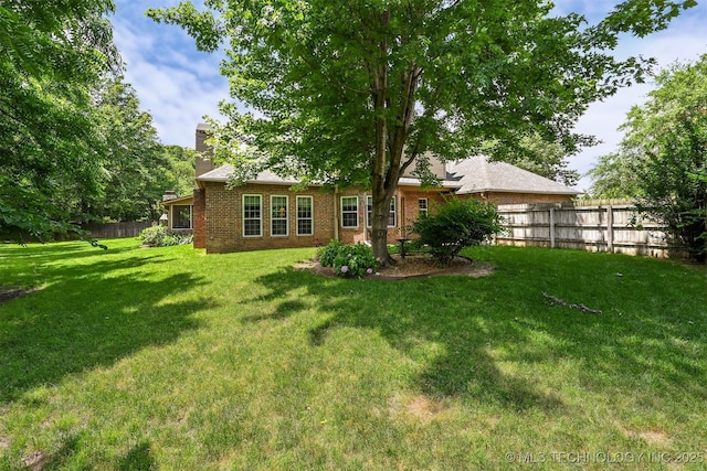 11586 S 66th E Ave, Bixby, OK 74008 - rear view of property with a chimney and brick siding