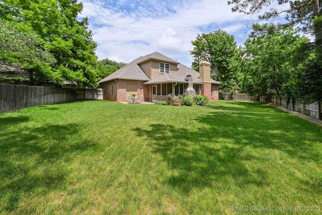 11586 S 66th E Ave, Bixby, OK 74008 - back of property with a chimney and brick siding