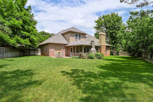 11586 S 66th E Ave, Bixby, OK 74008 - rear view of property with brick siding, a chimney, a sunroom, a shingled roof, and a patio area