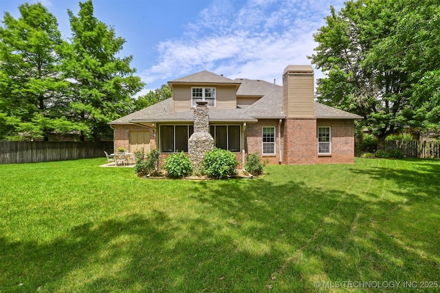 11586 S 66th E Ave, Bixby, OK 74008 - back of property featuring brick siding, a chimney, a shingled roof, a sunroom, and a patio