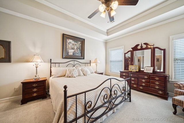 13234 S 68th E Ave, Bixby, OK 74008 - bedroom featuring light carpet, multiple windows, crown molding, a tray ceiling, and baseboards