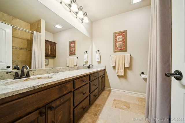 13234 S 68th E Ave, Bixby, OK 74008 - bathroom with double vanity, baseboards, and a tile shower