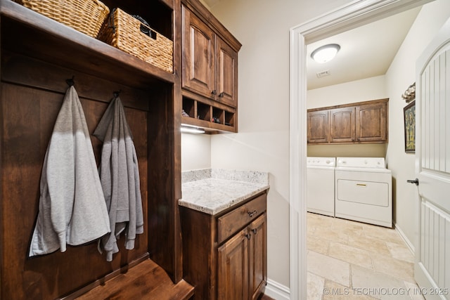 13234 S 68th E Ave, Bixby, OK 74008 - laundry area with independent washer and dryer, stone tile floors, cabinet space, and baseboards