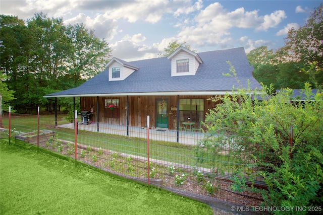 162 Dolittle Ln, Mcalester, OK 74501 - view of front of property featuring a vegetable garden, roof with shingles, a front yard, and a porch