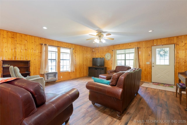 162 Dolittle Ln, Mcalester, OK 74501 - living area featuring healthy amount of natural light, wood-type flooring, wooden walls, ceiling fan, and recessed lighting