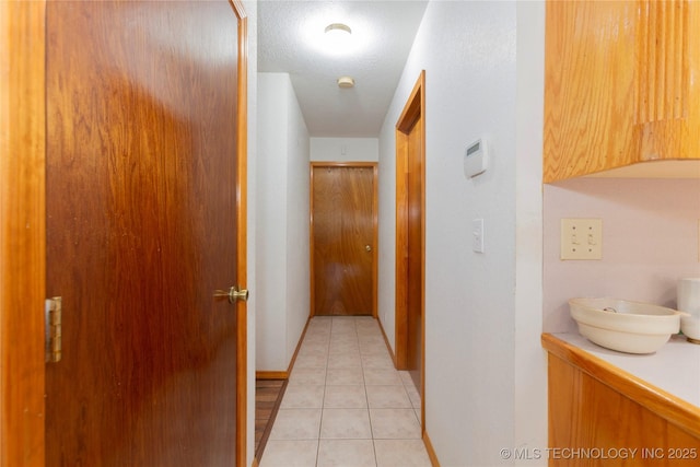 162 Dolittle Ln, Mcalester, OK 74501 - corridor featuring light tile patterned floors and baseboards