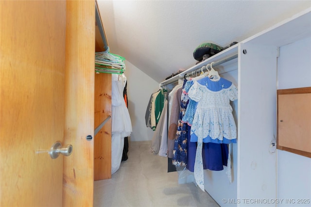 162 Dolittle Ln, Mcalester, OK 74501 - walk in closet featuring vaulted ceiling and carpet flooring