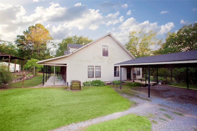 162 Dolittle Ln, Mcalester, OK 74501 - rear view of house featuring a lawn and driveway
