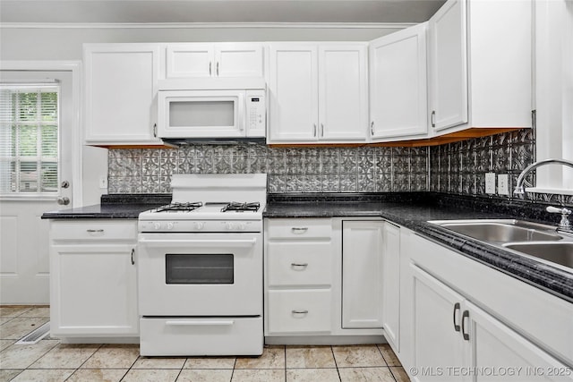 7128 E 5th Pl, Tulsa, OK 74112 - kitchen featuring white appliances, white cabinetry, a sink, and backsplash