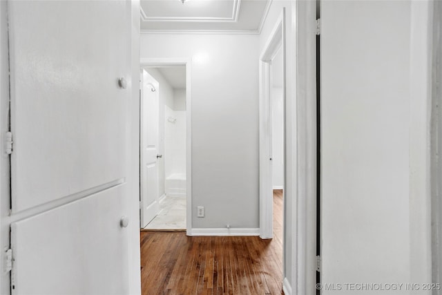 7128 E 5th Pl, Tulsa, OK 74112 - hallway featuring wood finished floors, ornamental molding, and baseboards