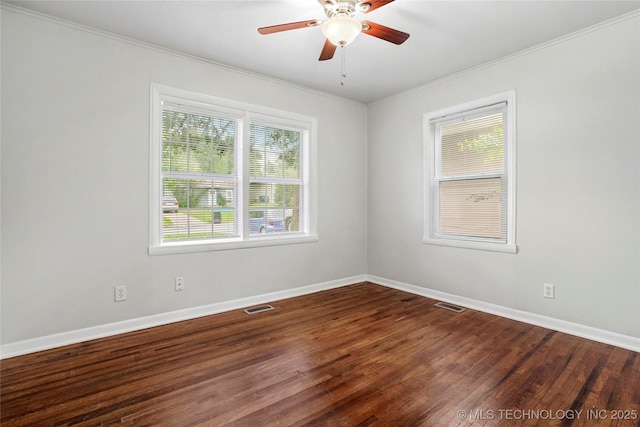 7128 E 5th Pl, Tulsa, OK 74112 - unfurnished room featuring ornamental molding, baseboards, a ceiling fan, and dark wood finished floors