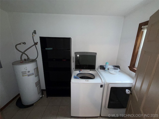 111 Hickory, Durant, OK 74731 - laundry area featuring washing machine and dryer, electric water heater, and light tile patterned floors