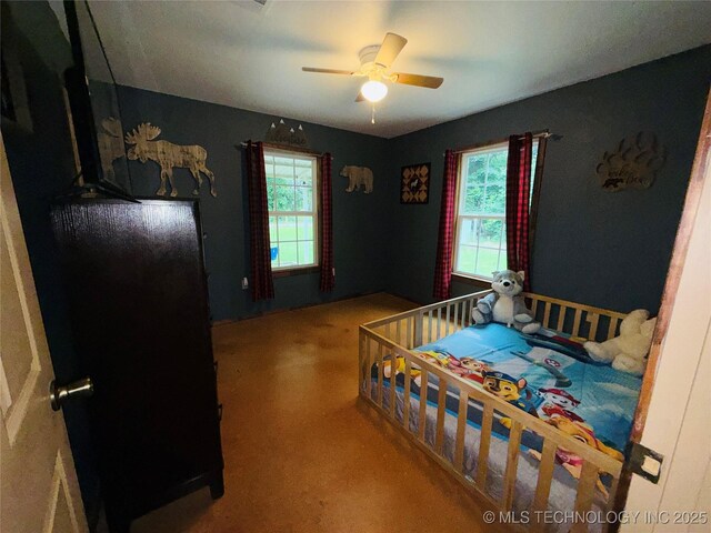111 Hickory, Durant, OK 74731 - carpeted bedroom featuring multiple windows and a ceiling fan