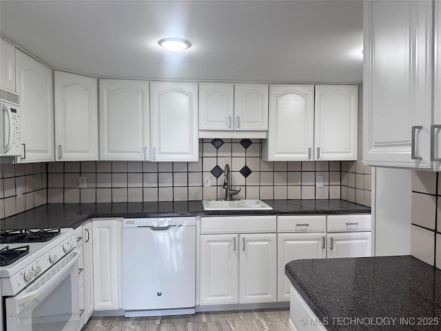 410 W 7th St Unit 727, Tulsa, OK 74119 - kitchen with white appliances, a sink, white cabinetry, and backsplash
