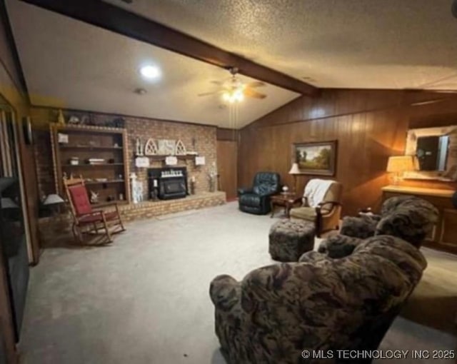 5616 Stonecreek, Durant, OK 74701 - living room with carpet flooring, wooden walls, a ceiling fan, a textured ceiling, and a brick fireplace