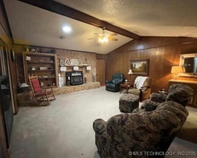 5616 Stonecreek, Durant, OK 74701 - carpeted living room featuring wood walls, ceiling fan, and a textured ceiling