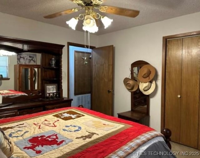 5616 Stonecreek, Durant, OK 74701 - bedroom featuring a textured ceiling, ceiling fan, a closet, and carpet floors