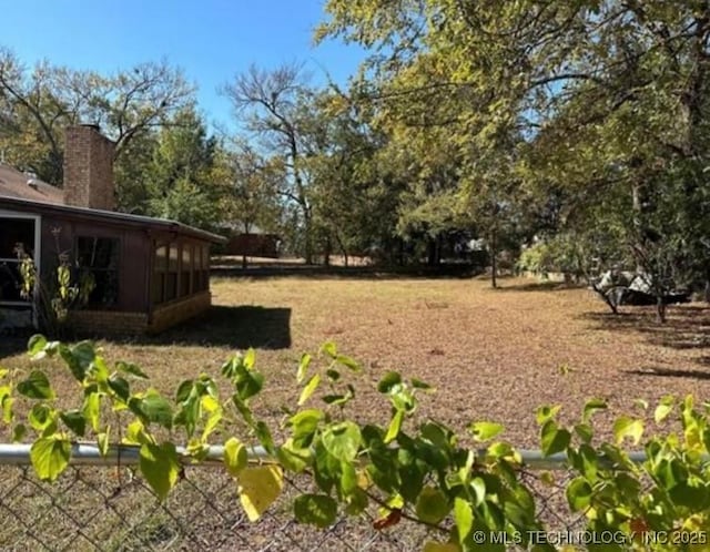 5616 Stonecreek, Durant, OK 74701 - view of yard featuring a sunroom