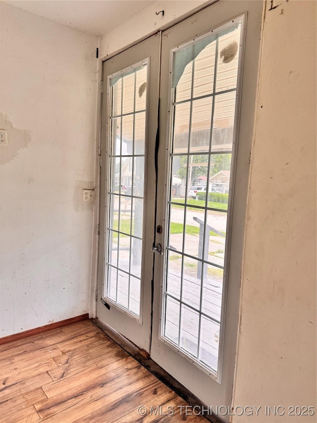 622 H NW, Ardmore, OK 73401 - doorway featuring light wood-type flooring, healthy amount of natural light, and french doors