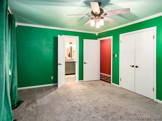 801 S Rennie St, Ada, OK 74820 - unfurnished bedroom featuring crown molding, carpet flooring, a closet, ceiling fan, and ensuite bath