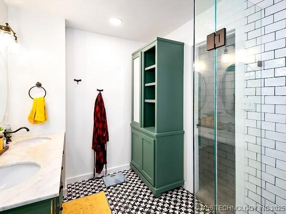 801 S Rennie St, Ada, OK 74820 - full bathroom featuring a shower stall and double vanity
